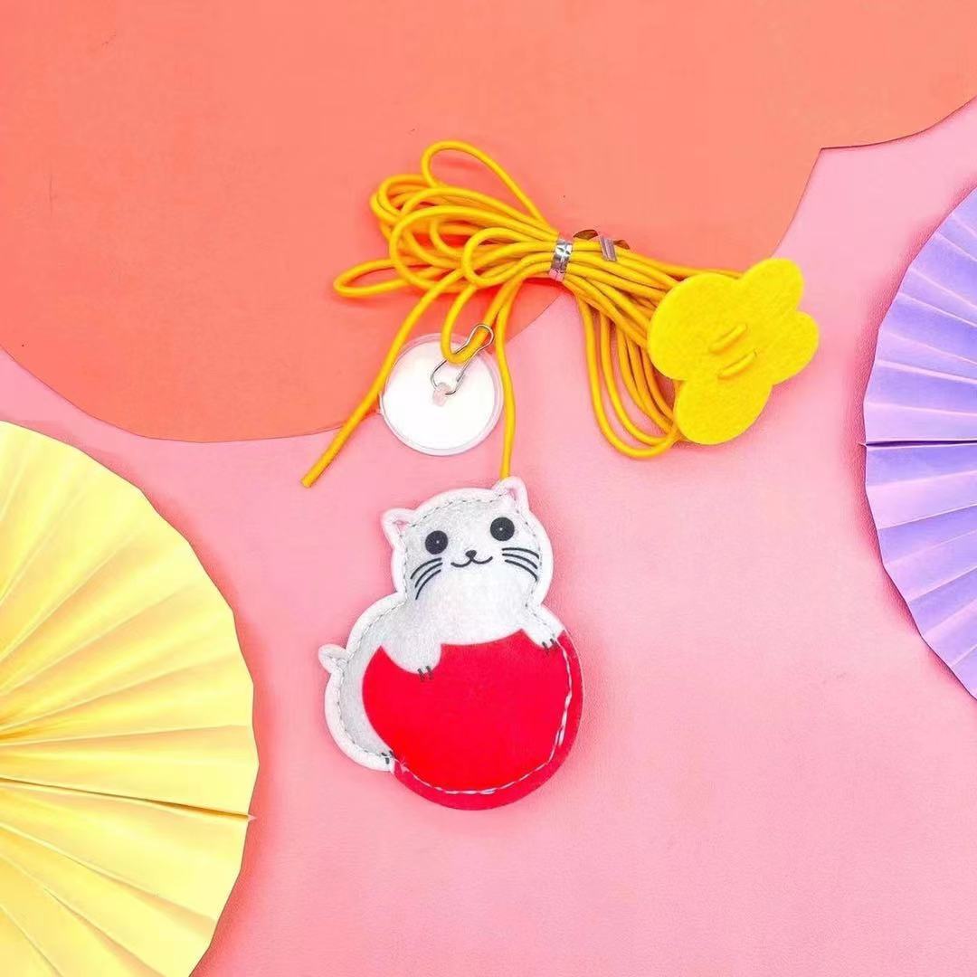 Cat wand toy — lifestyle with cat mid-leap